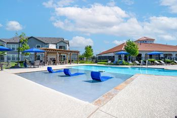 Resort-style swimming pool with sundeck